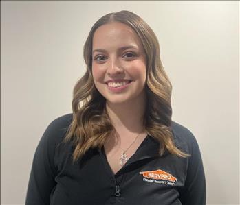 Female SERVPRO employee standing in hallway