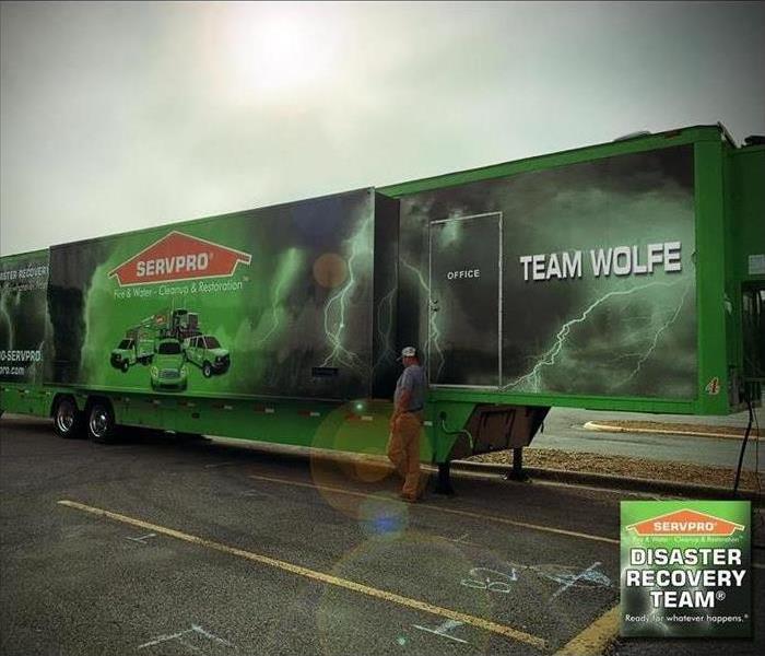 a 53' SERVPRO commercial trailer with graphics sitting in a parking lot
