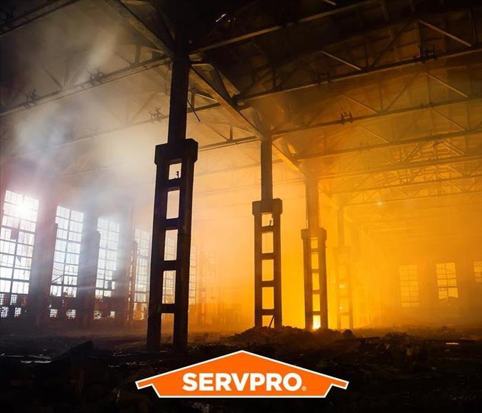 burned out warehouse with the SERVPRO brand logo in the picture